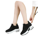 Black and white platform sneakers.