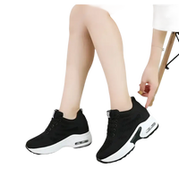 Black and white platform sneakers.