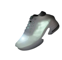 Illuminated white athletic shoe.
