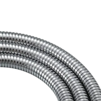Shiny, flexible metal hoses.