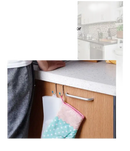 Kitchen cabinet door with hanging hooks.