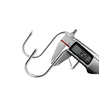 Stainless steel S-hooks being measured.