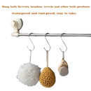 Bathroom accessories hanging on a metal bar.