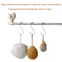Bathroom accessories hanging on a metal bar.