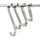 Four shiny metal S-hooks.