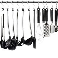 Kitchen utensils hanging on a rack.