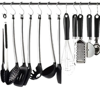 Kitchen utensils hanging on a rod.