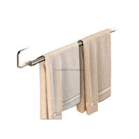 Black towel bar with towels.