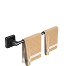 Black metal towel rack with two beige towels.