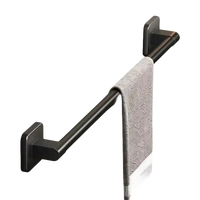 Black metal towel bar with towel.