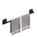 Black towel bar with gray towels.