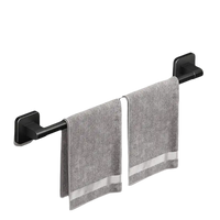 Black towel bar with gray towels.