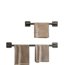 Two dark metal towel bars with towels.