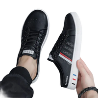 Black and white slip-on sneakers.