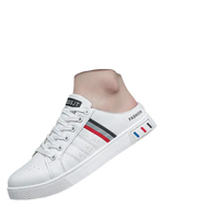 White slip-on sneakers.