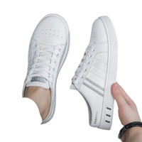 White slip-on sneakers.