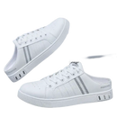 White slip-on sneakers.