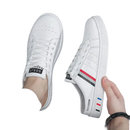 White slip-on sneakers.
