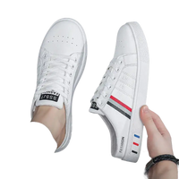 White slip-on sneakers.