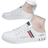 White slip-on sneakers.