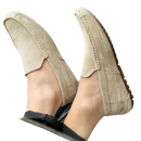 Beige suede driving shoes.