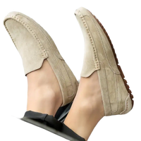 Beige suede driving shoes.