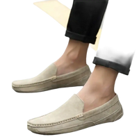 Beige suede loafers.