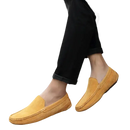 Mustard-colored suede loafers.