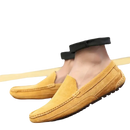 Mustard-colored suede loafers.