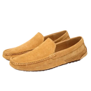 Pair of tan suede loafers.