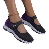 Black and purple Mary Jane style sneakers.