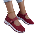 Burgundy Mary Jane sneakers.