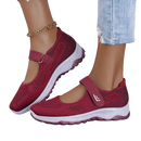 Burgundy Mary Jane sneakers.