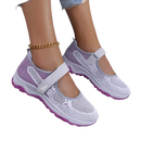 White and purple Mary Jane sneakers.