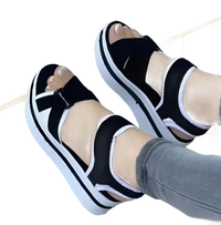 Black and white platform sandals.