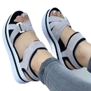 Platform sandals with gray straps.