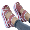 Platform sandals with pink straps.