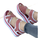 Platform sandals with pink straps.