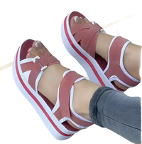 Platform sandals with pink straps.