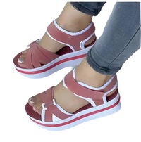 Platform sandals with pink straps.