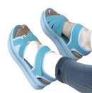 Turquoise and white platform sandals.