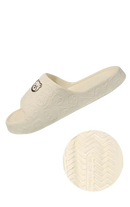 Beige anti-slip textured slipper.
