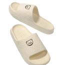 Cream-colored bear-themed slide sandals.