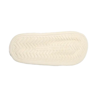 Cream-colored shoe sole with zigzag pattern.