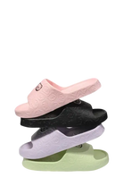 Stacked pastel-colored home sandals.