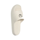 Cream-colored cartoon slippers.