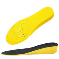 Yellow shoe insoles with black tops.