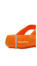 Orange thick-soled sandal.