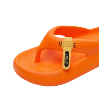 Orange flip-flop with a label.