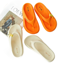 Orange and white flip-flops.